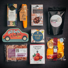 Load image into Gallery viewer, Happy Christmas Hamper featuring regional Australian produce, featuring Christmas Cake, Cure Tin in shape of car filled with assorted nougat. Fun pop corn on the cob, Chocolate Sultanas,Chocolate Nuts, Colourful Dried Fruit including mango, kiwi, strawberries, pineapple, apples, Large block of Rock Road, Crispy Raspberry Biscuits. Perfect family hamper. Fun Fact: this hamper employed 141 regional Australians.